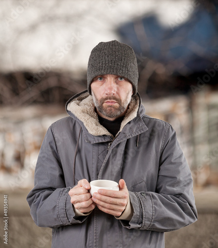 adult man holding cup