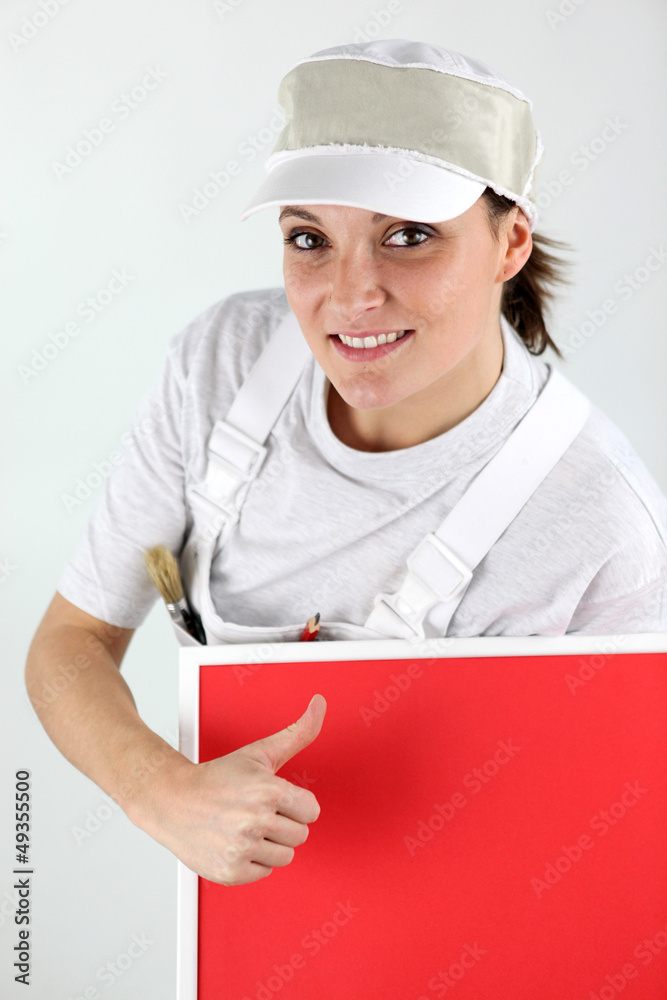 craftswoman painter holding a painted board craftswoman painter holding a painted board