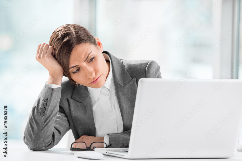Portrait of beautiful executive working on computer at office Portrait of beautiful executive working on computer at office