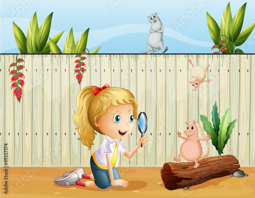 Wild animals and a girl with a magnifying glass