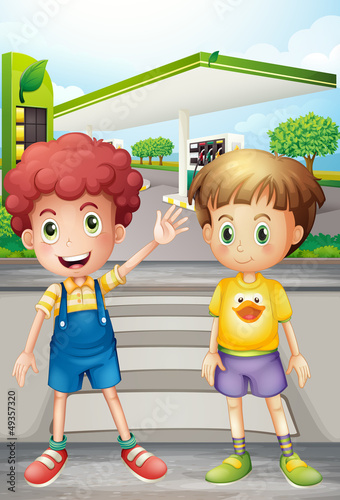 Two little boys near the gasoline station