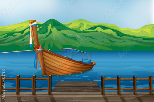 A wooden boat tied at the seaport