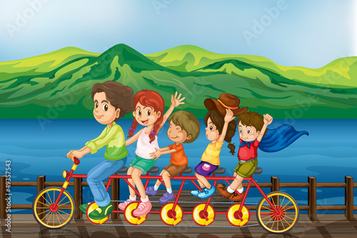 Kids biking at the bridge