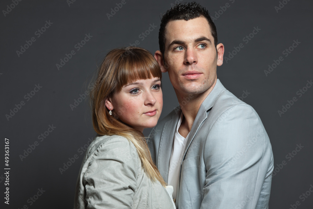 Young couple man and woman in love. Studio shot. Young couple man and woman in love. Studio shot.