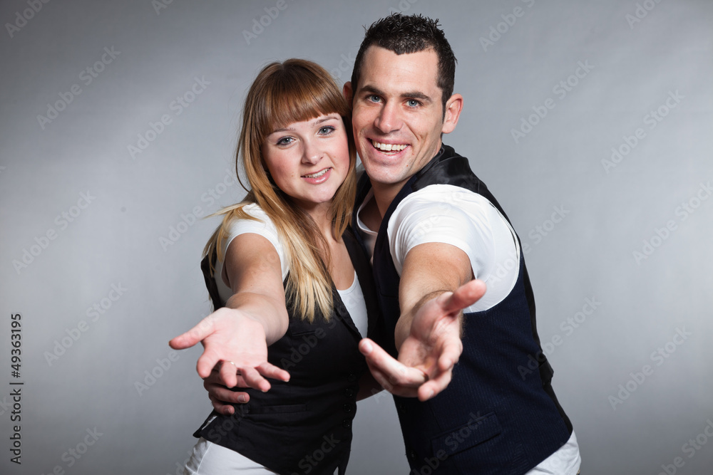 Obraz premium Beautiful young couple man and woman in love. Studio.