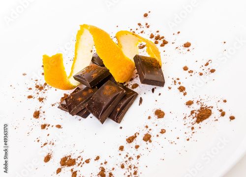 broken dark chocolate with orange peel photo