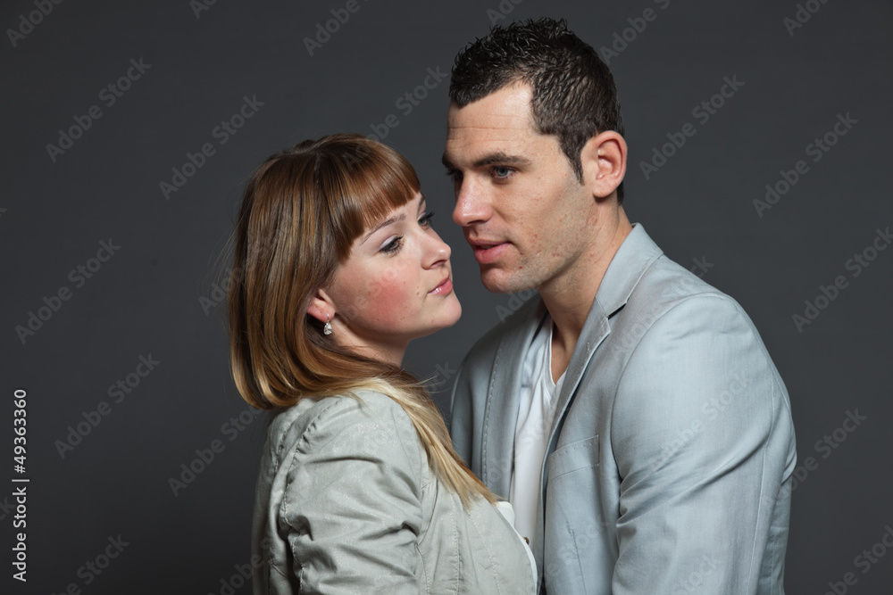 Young couple man and woman in love. Studio shot. Young couple man and woman in love. Studio shot.