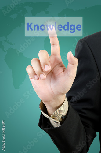 businessman hand touching knowledge button