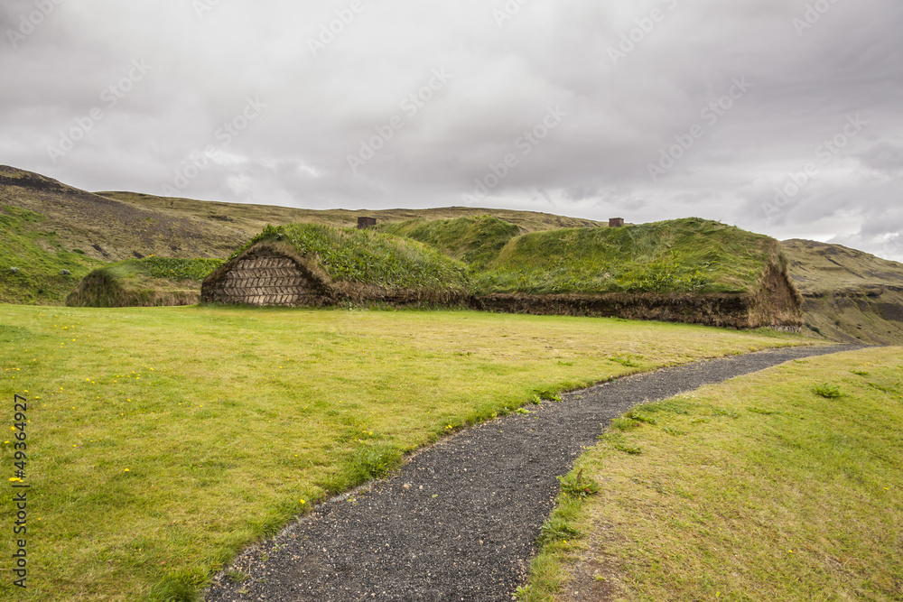 Traditional Icelandic house with mossy roof - Pjodveldisbaer