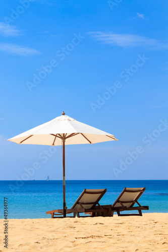 beds and umbrella on a beach