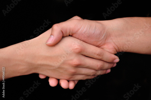 Close up of people shaking hands