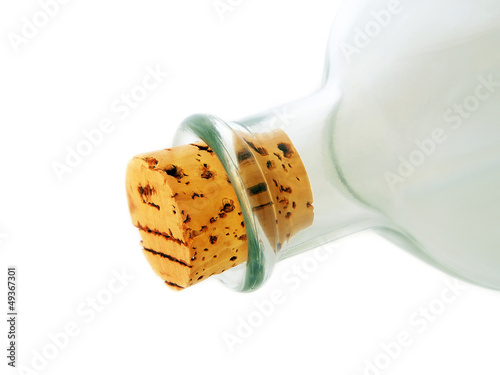 Empty glass half bottle with cork on white background