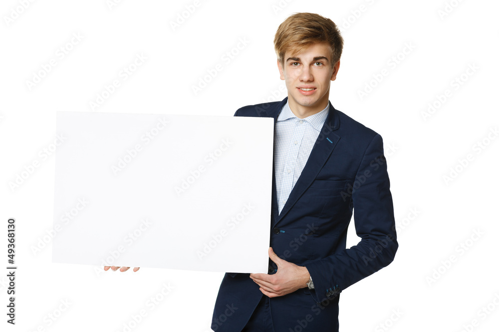 Young man in suit holding blank whiteboard Young man in suit holding blank whiteboard