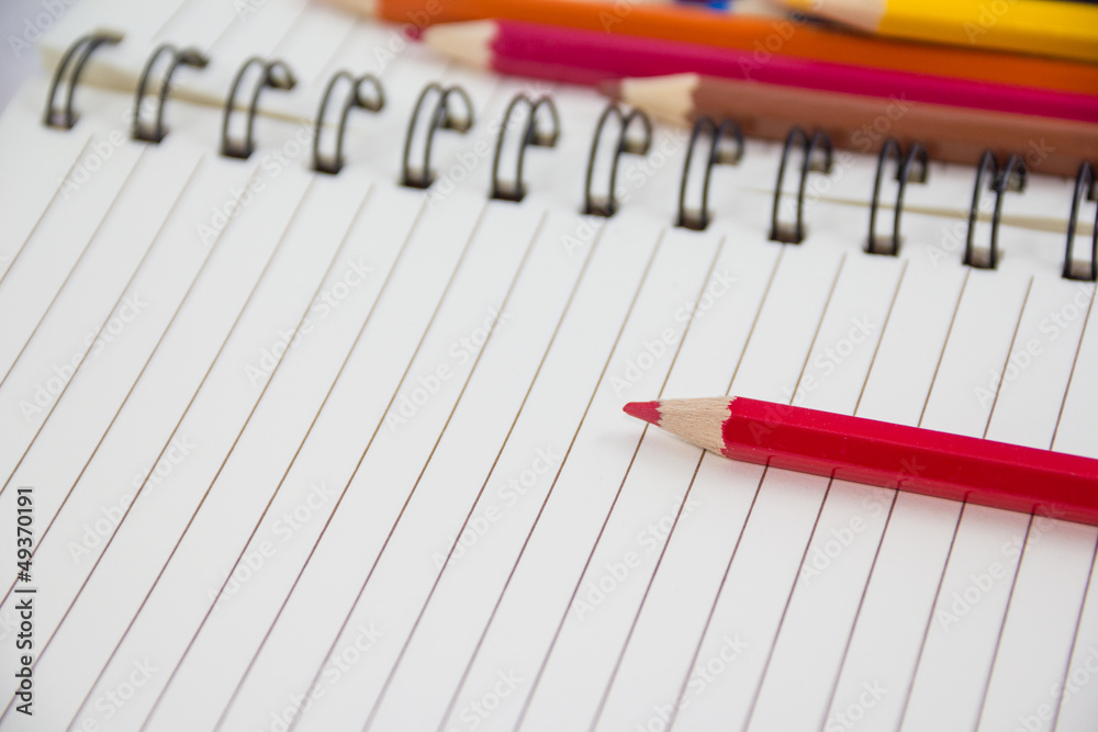 Colorful pencils and notebook Colorful pencils and notebook