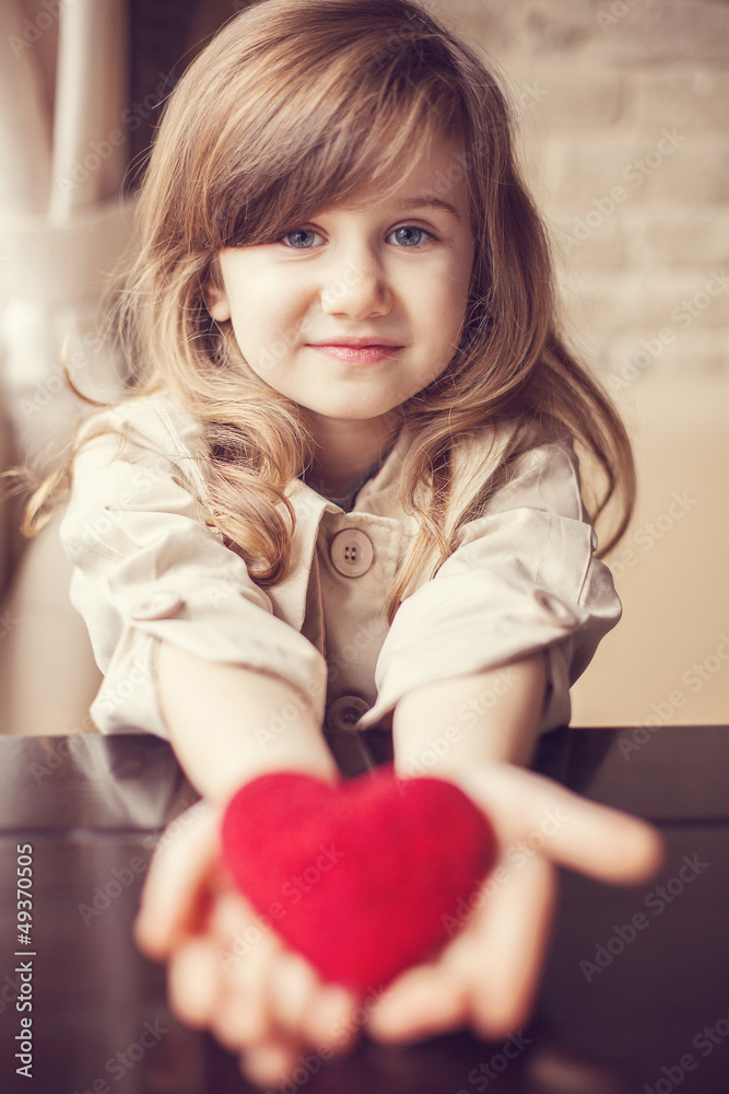 Valentine's Day - dreaming cute child with red Heart in hands Valentine's Day - dreaming cute child with red Heart in hands