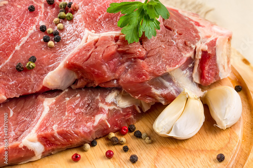 Raw beef steak with garlic