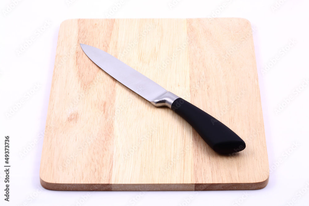 Knife on cutting board isolated Knife on cutting board isolated
