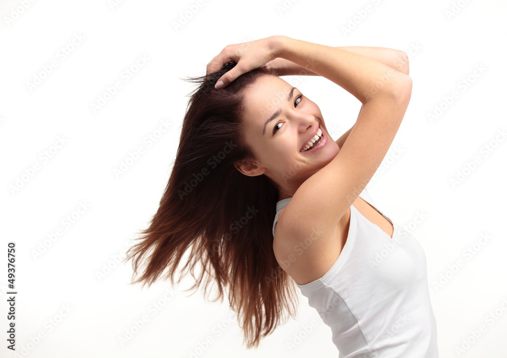 Portrait of a beautiful young woman with hair flying
