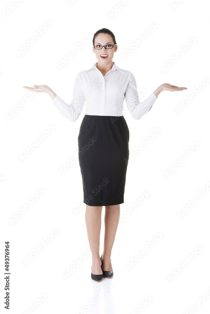 Happy young business woman showing copy space Happy young business woman showing copy space