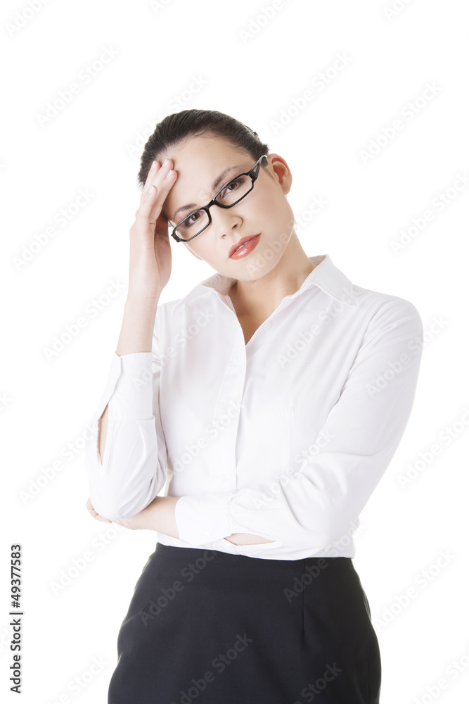 Businesswoman with a headache holding head Businesswoman with a headache holding head