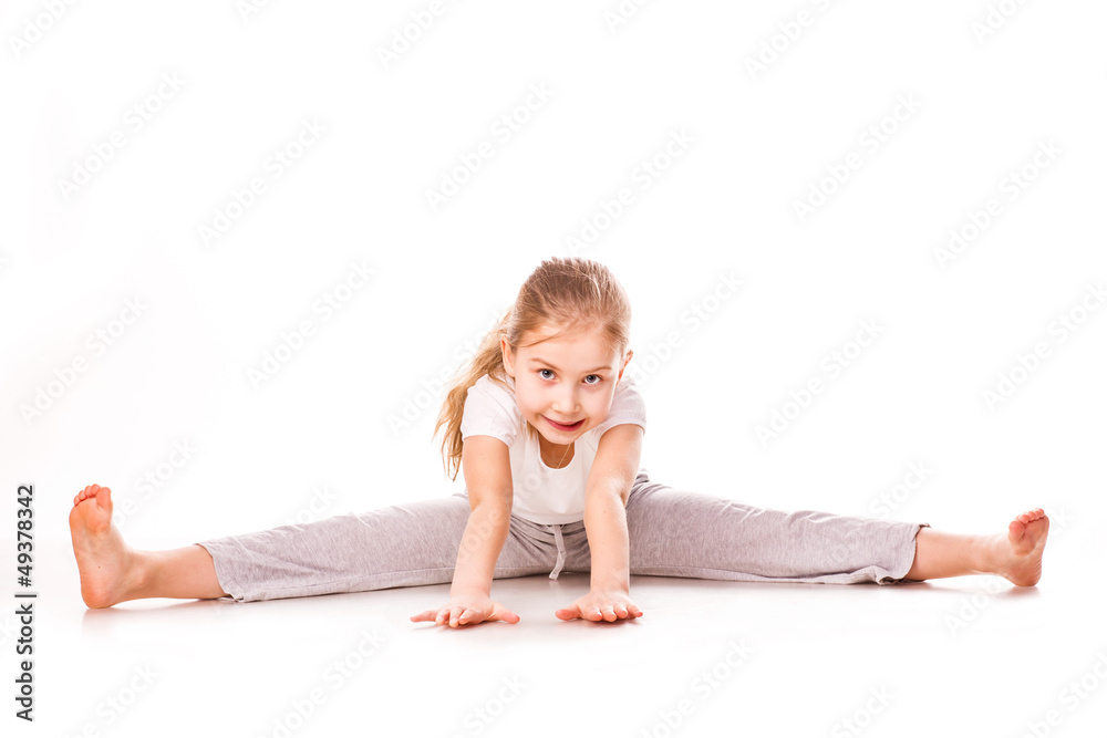 Beautiful girl gymnast exercising, stretching Beautiful girl gymnast exercising, stretching