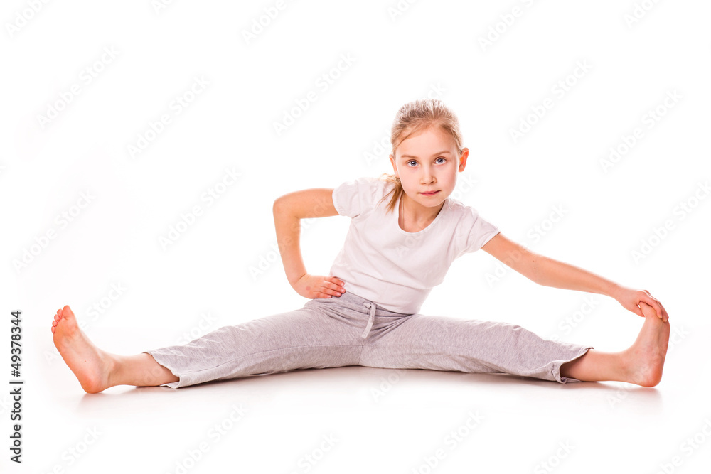 Beautiful girl gymnast exercising, stretching Beautiful girl gymnast exercising, stretching
