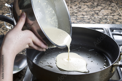 Pouring Pancake mix into hot frying pan