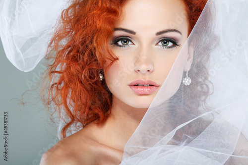 Portrait of beautiful redheaded bride. Wedding decoration