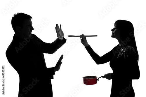 one couple man and woman tasting cooking sauce pan