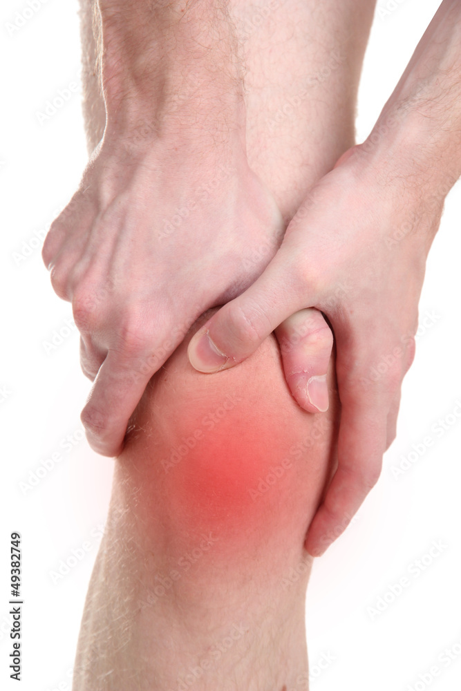Man holding sore knee, isolated on white Man holding sore knee, isolated on white