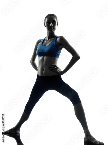 woman exercising yoga warrior position