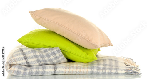 Woolen checkered plaid and pillows, isolated on white