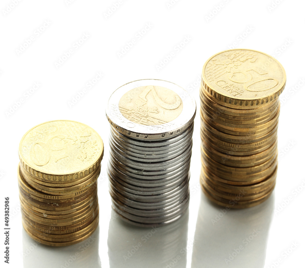 Many coins in columns isolated on white Many coins in columns isolated on white