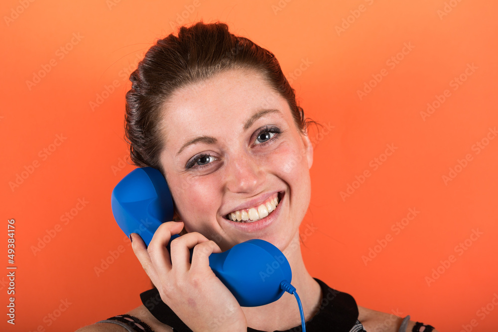 Smiling Young Woman with Phone Receiver Smiling Young Woman with Phone Receiver