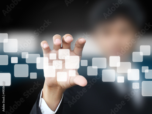 Businessman holding touchscreen