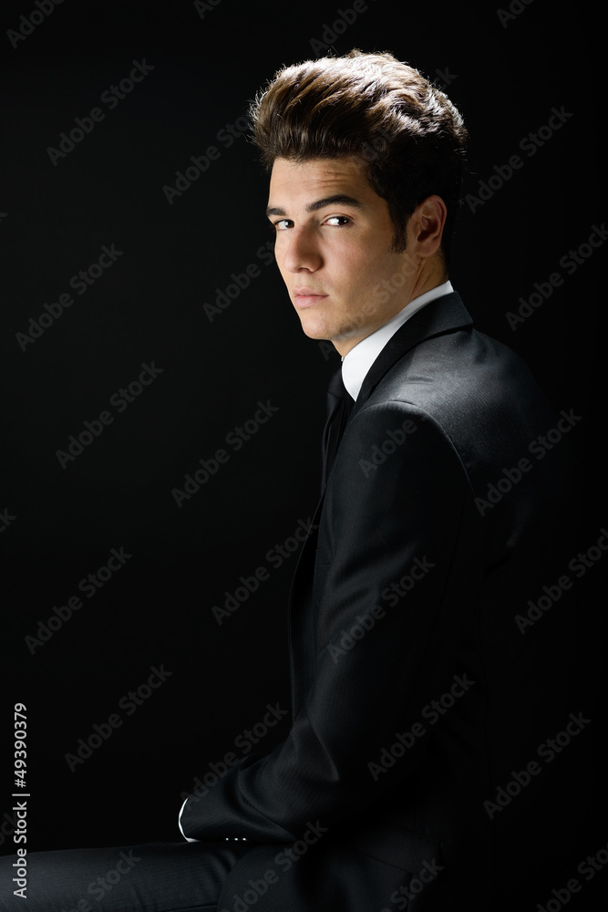 Young businessman, isolated on black background Young businessman, isolated on black background