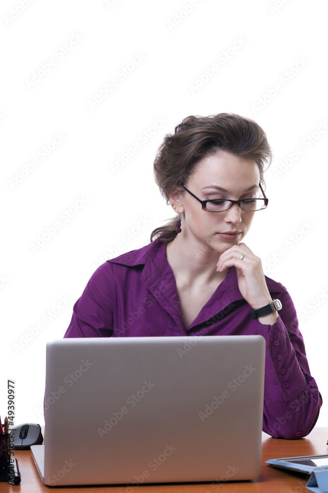 Young businesswoman at an office desk isolated on white Young businesswoman at an office desk isolated on white