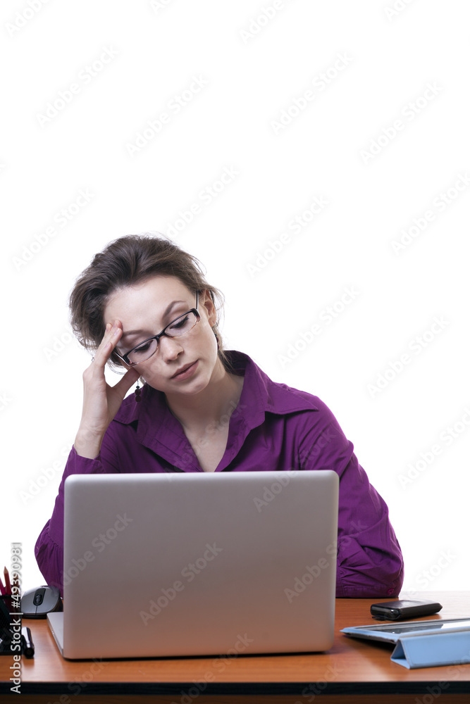 Nervous businesswoman at an office desk isolated on white Nervous businesswoman at an office desk isolated on white