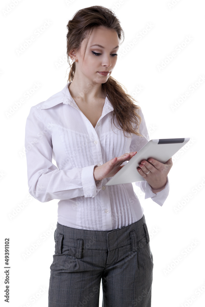 Young girl working at a digital tablet isolated on white Young girl working at a digital tablet isolated on white