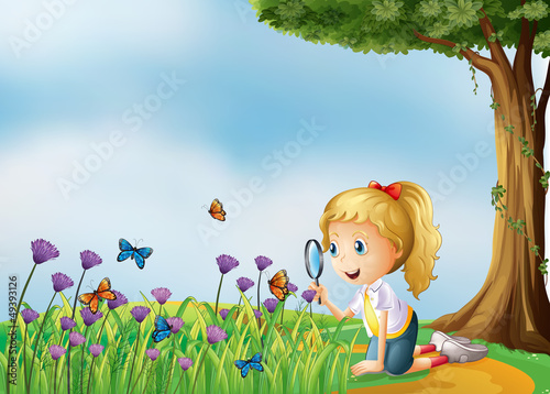 A smiling girl and a magnifier