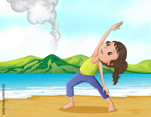 A woman exercising at the beach