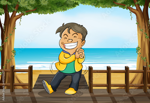 A smiling boy and a beach
