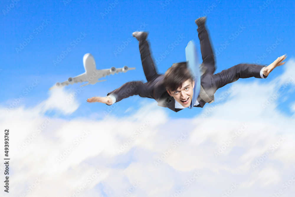Young businessman flying with parachute on back Young businessman flying with parachute on back