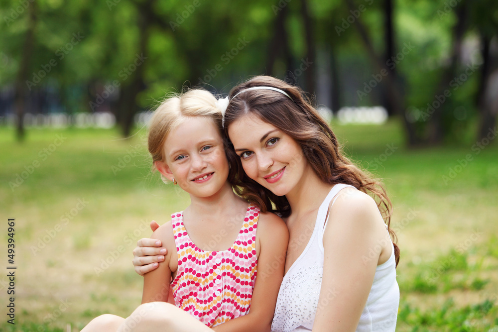 Mother and daughter in the park Mother and daughter in the park