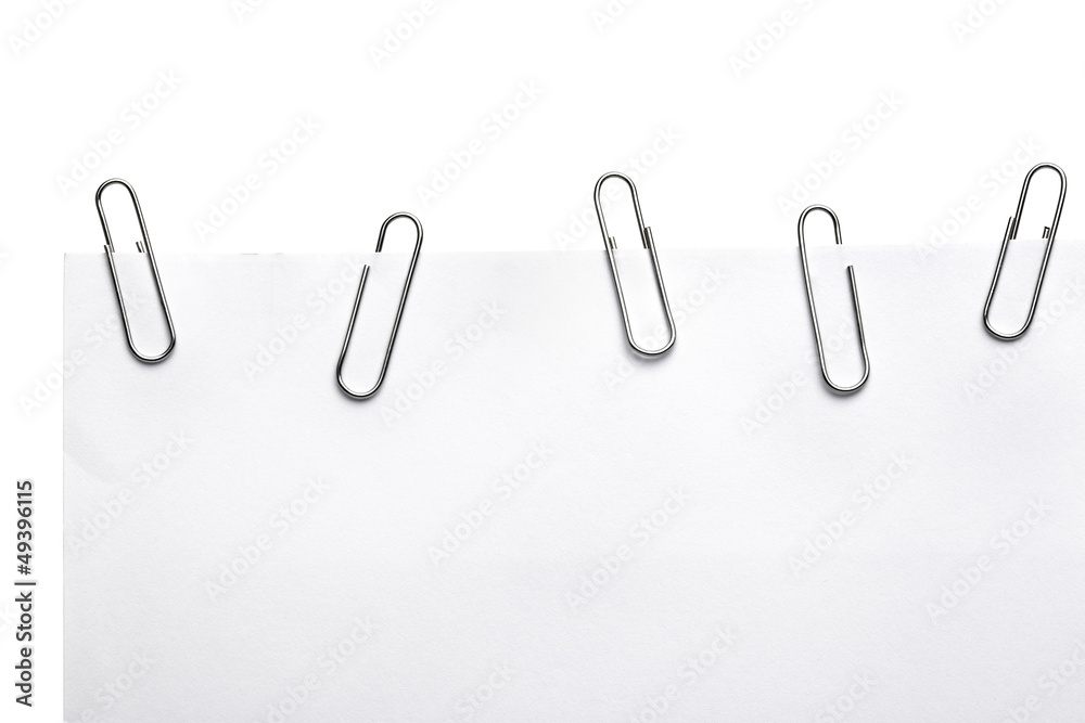 Paper clips on white piece of paper Paper clips on white piece of paper