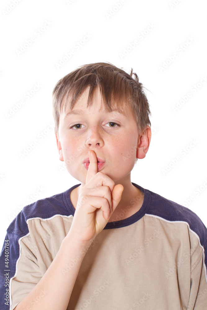 Teen boy shows his finger gently Teen boy shows his finger gently