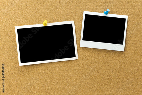 Blank photo frame at the cork board with clipping path
