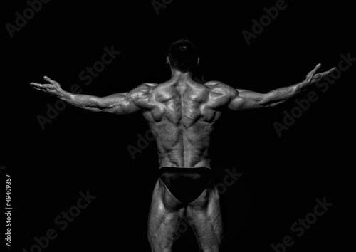 Fit male model showing his back