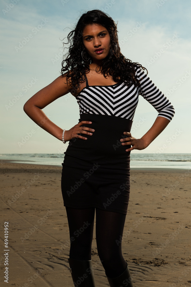 Pretty indian girl with long hair on the beach in summer. Pretty indian girl with long hair on the beach in summer.