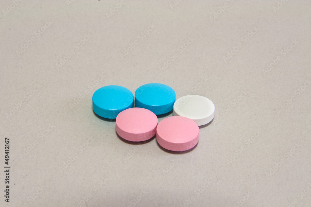 Colored pills on paper Colored pills on paper